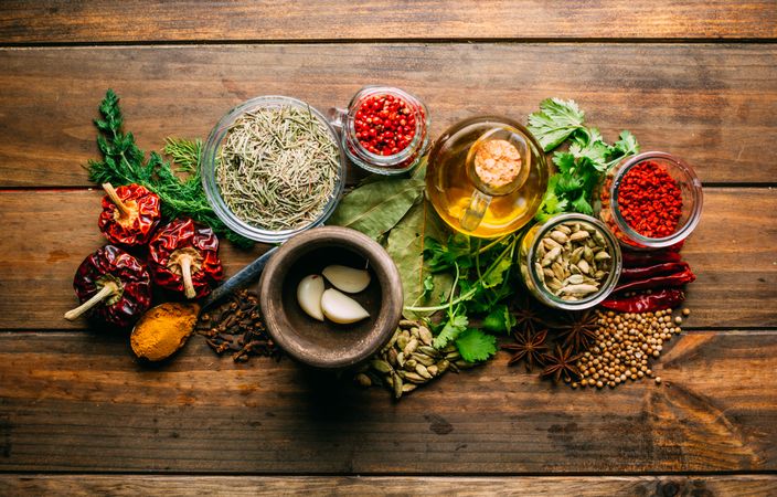 Spices and oil on table