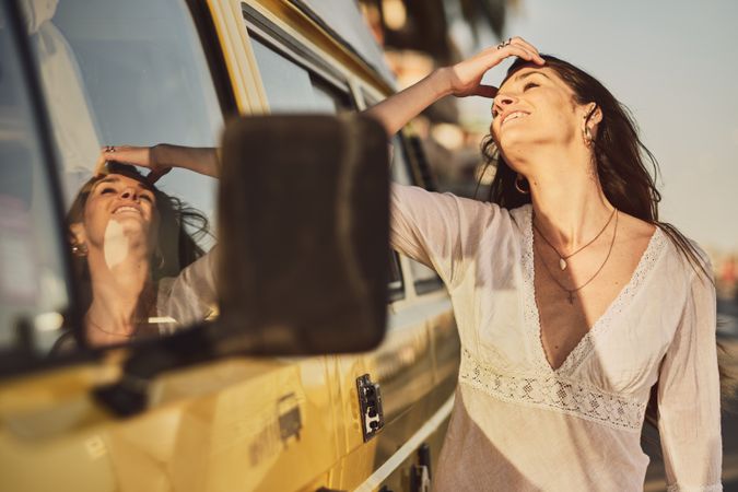 Young woman on a yellow van