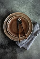 Top view of table setting with elegant ceramic plate