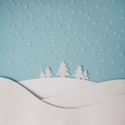 Christmas winter landscape with snowy hills and trees