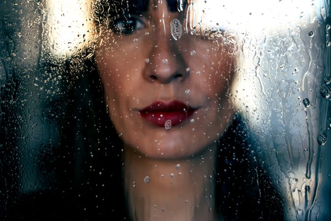 Stylish woman kissing glass