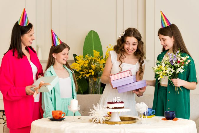 Girl receives birthday gifts from family and friends