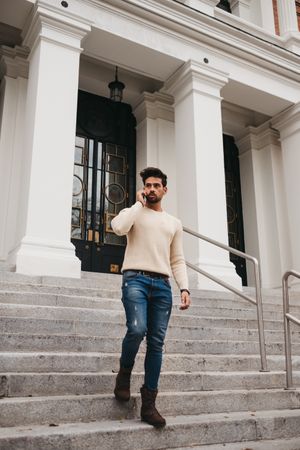 Trendy young male using smartphone