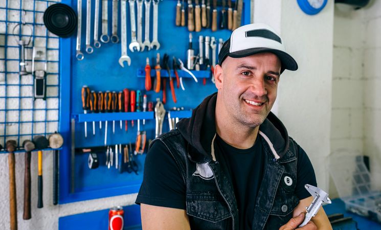 Mechanic posing with a motorcycle
