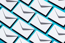 Many light envelopes over teal background