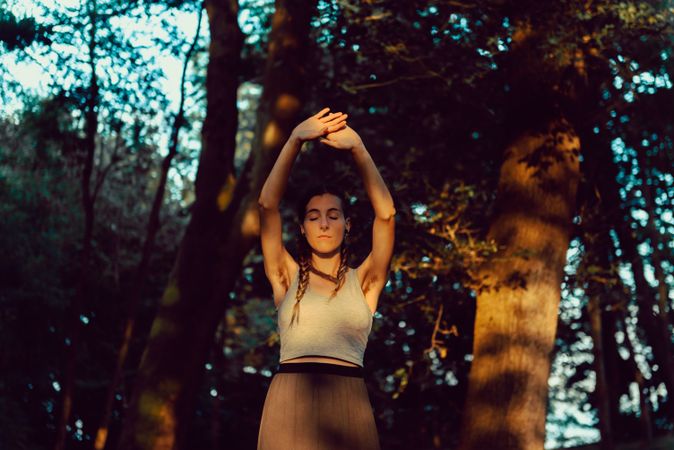 Young woman in majestic forest