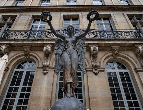 Ancient sculpture in one of the churches of Paris. Antique art.