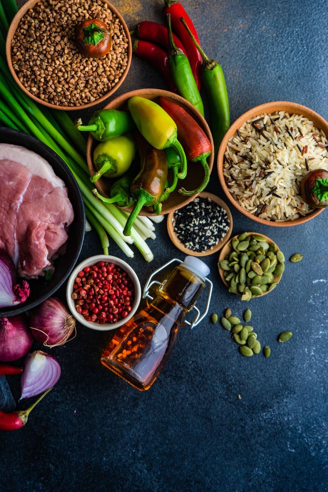 Grains and raw meat on kitchen counter in preparation for dinner