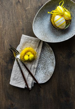 Top view of yellow eggs on grey plates