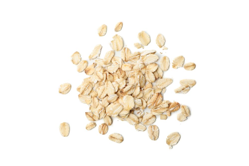 Oatmeal flakes bunch isolated on blank background