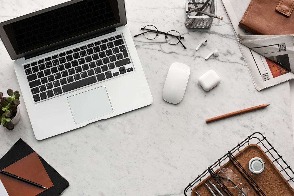 Modern Workspace Desk with Laptop, Office Supplies, and Accessories in a Minimal Style