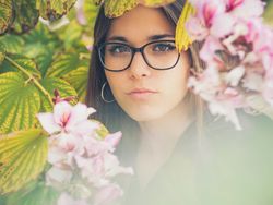 Portrait of woman among blooming trees
