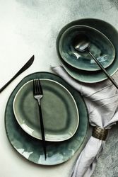 Top view of full table setting on grey counter