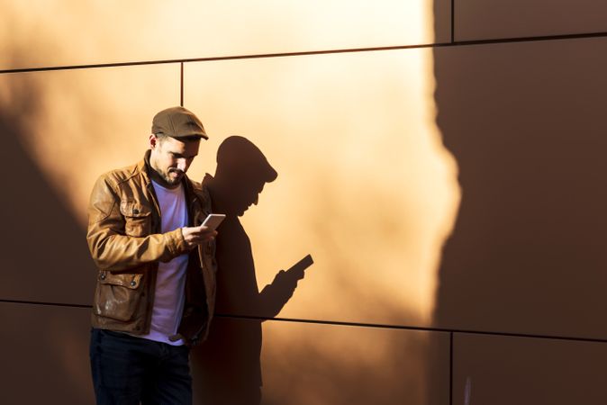 Man using mobile phone in modern building
