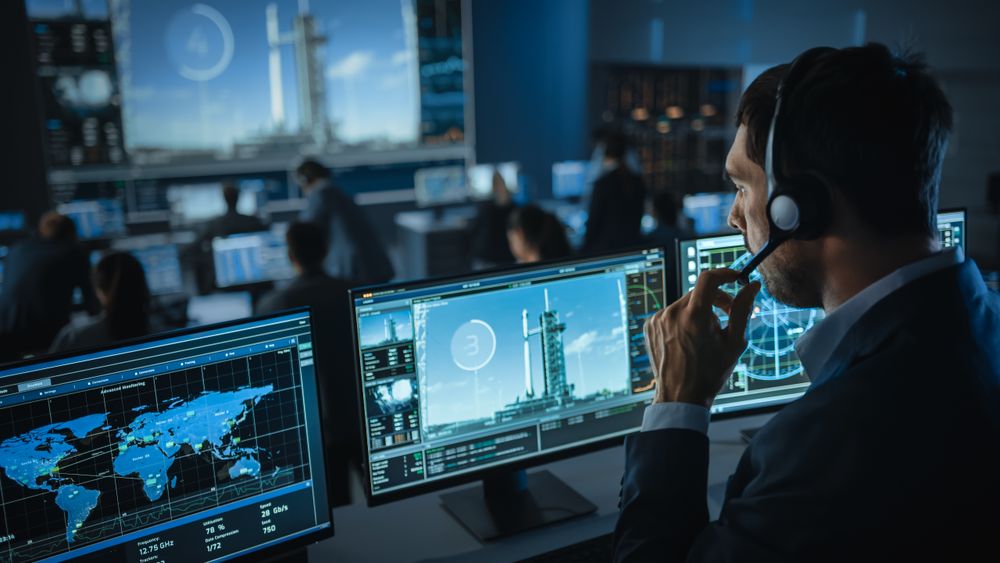Aerospace Technician Monitors Global Satellite Network and Rocket Launch.