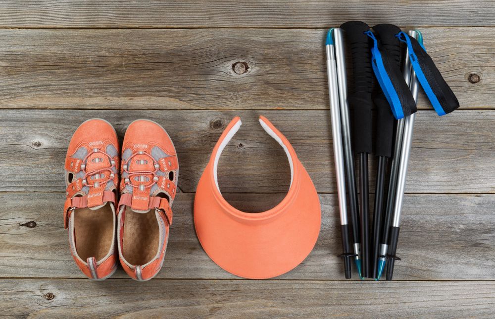 Brand new outdoor walking accessories on rustic wood