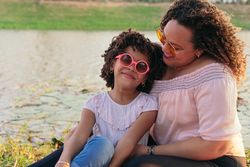 Mother and Daughter Having Healthy Picnic Outdoors.