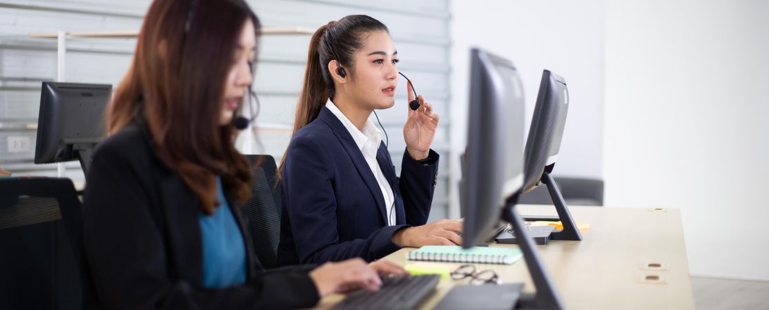 Banner of business call center with women in headsets sitting in office desk using computer