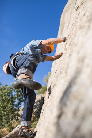 Free climber climbing in nature