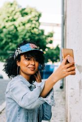 Stylish female taking selfie