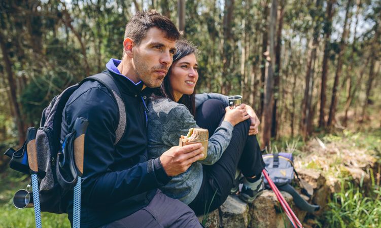 Couple pausing while doing trekking