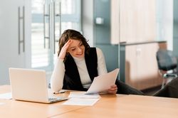 Woman working on her laptop in the office