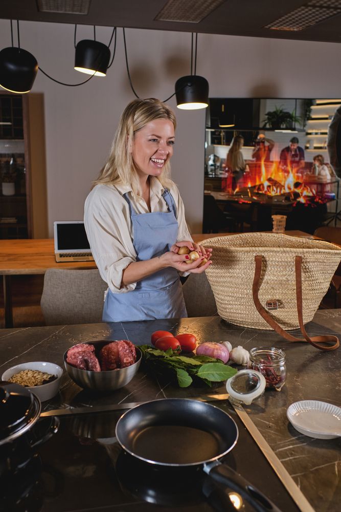 Cheerful woman at table with basket