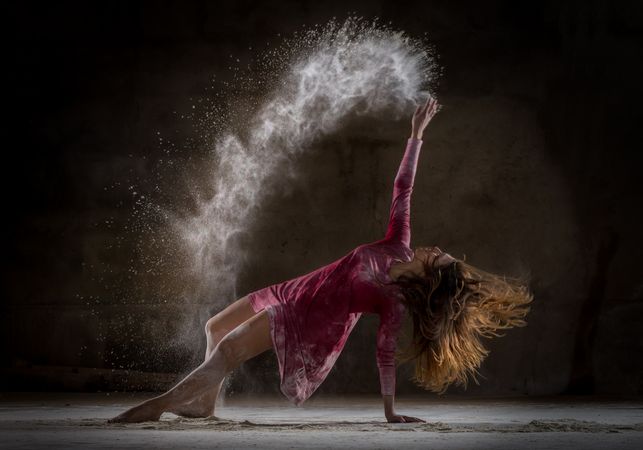 Young woman between fog in darkness