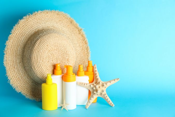 Summer vacation accessories on color background, space for text. Safe tan