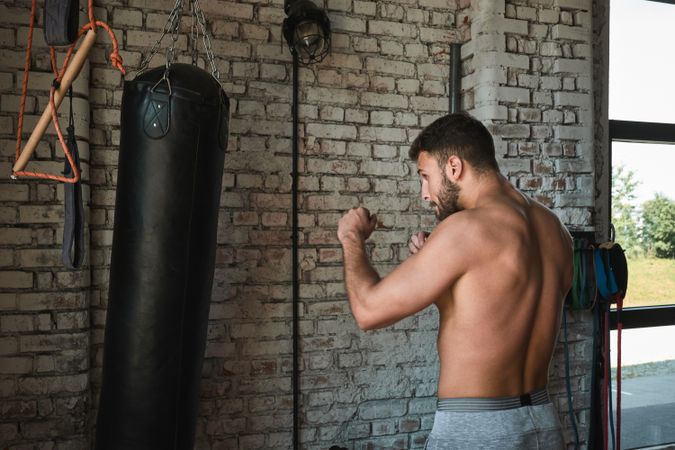 Man boxing in gym
