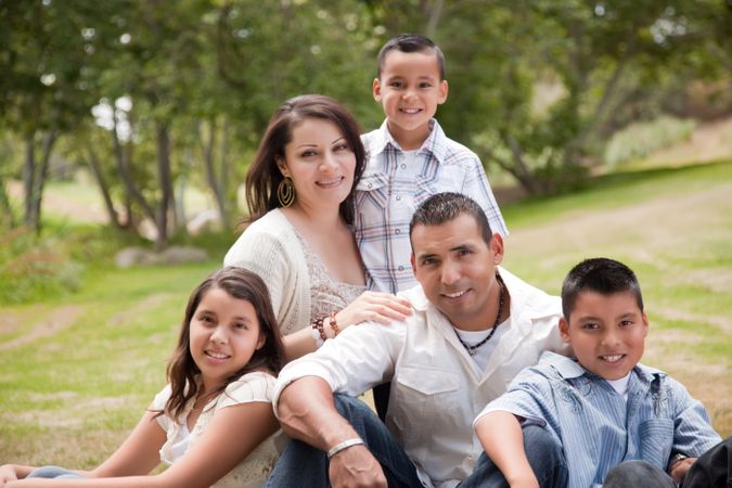 Happy Hispanic Family In the Park