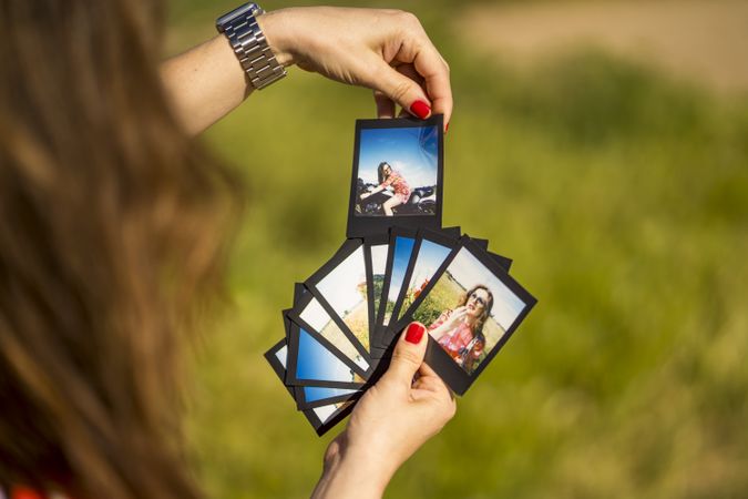 Young woman showing summer photos