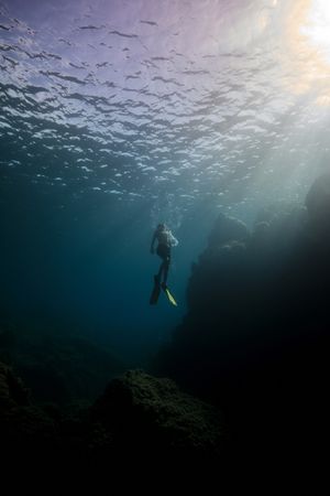 Anonymous man floating underwater