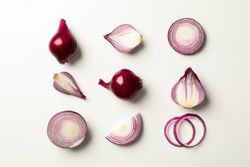 Flat lay composition with red onion on neutral background