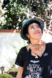 Woman looking up in hard hat