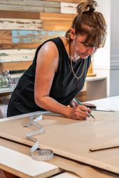 Fashion designer drawing fashion patterns. Vertical shot