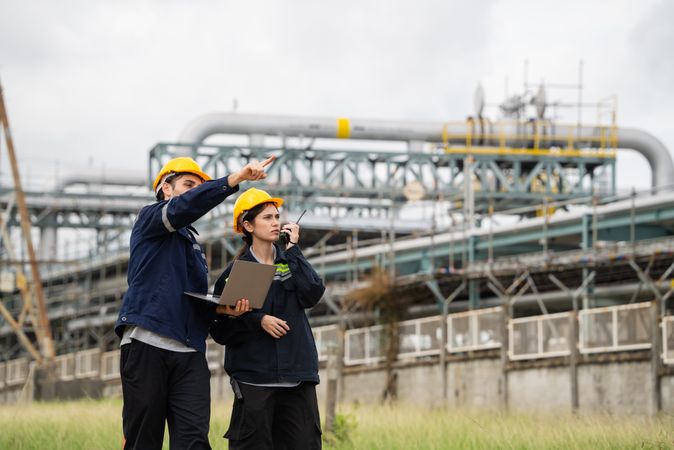 Engineer worker checking project at petrochemical factory or refinery oil plant industrial.