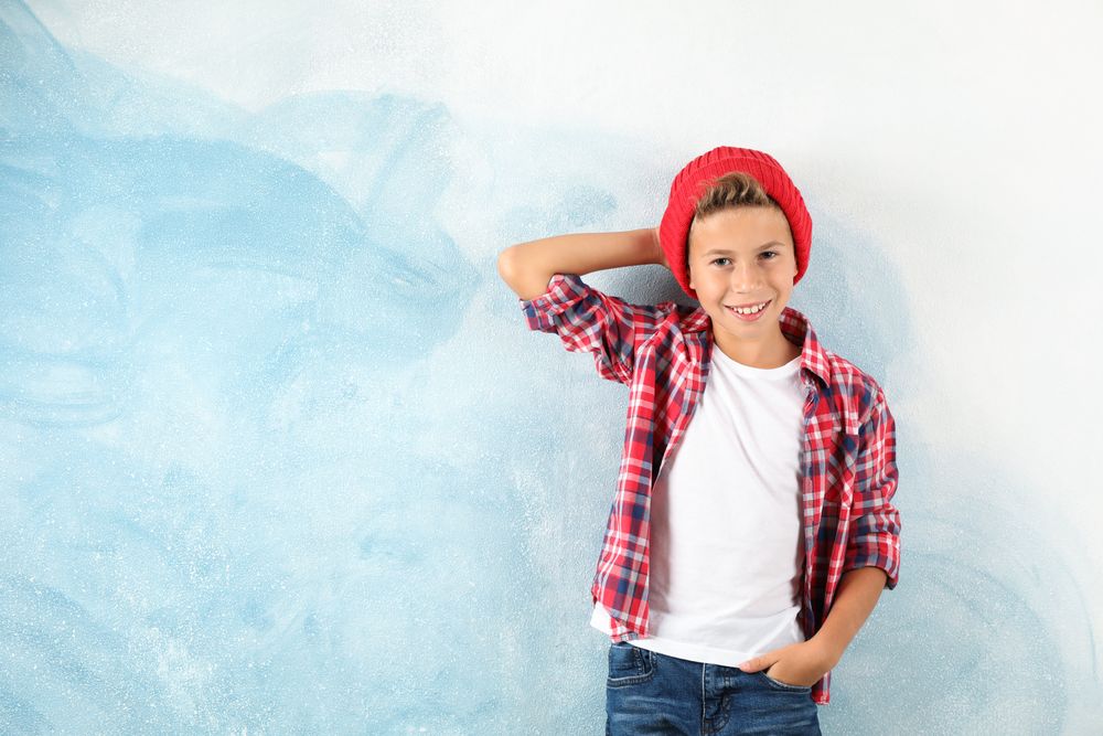 Fashion boy on color background, space for text