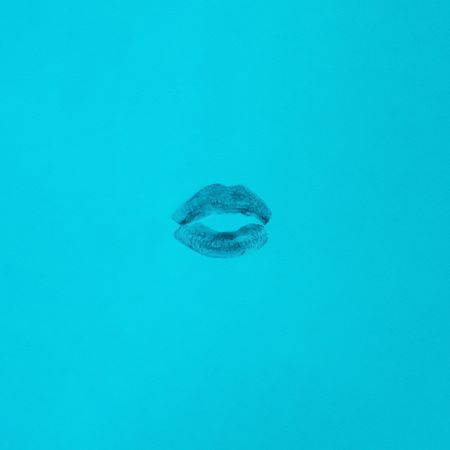 Lipstick mark on blue background