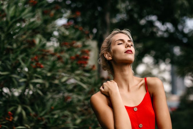 Dreamy young woman in summer garden