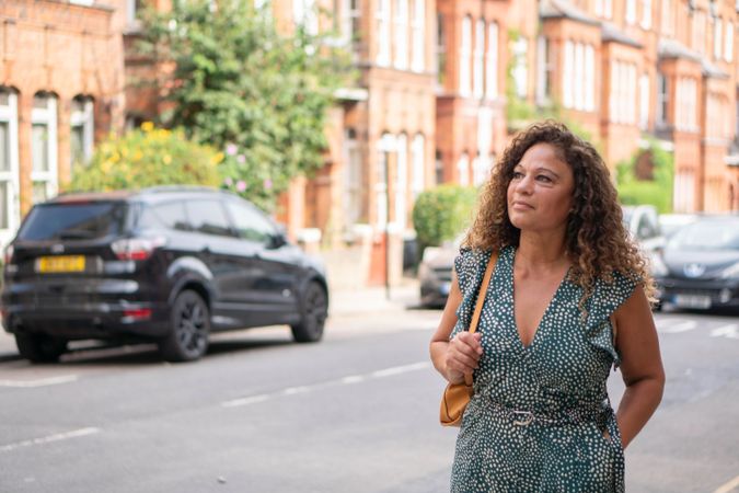 Black woman walking on city street