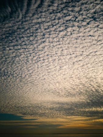 Picturesque cloudy sky at sundown