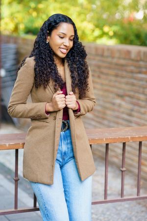 A Stylish and Fashionable Young Woman Embracing Casual Outdoor Fashion with Confidence