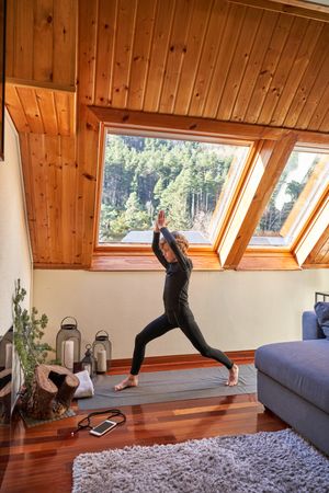 Boy stretching body while doing yoga
