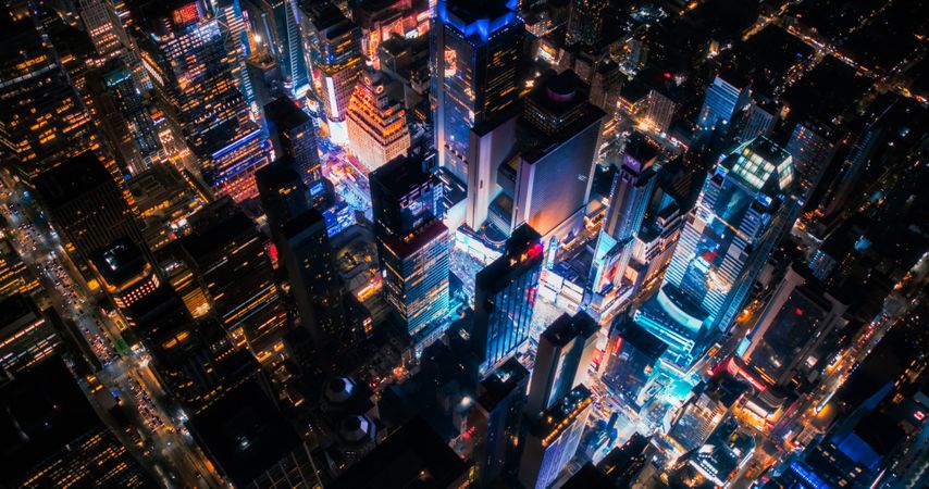 Helicopter Night Tour of New York City Architecture. Glowing Times Square with Groups of Tourists Enjoying Manhattan Nightlife and Admiring the Landmark with Diverse Advertising Billboards