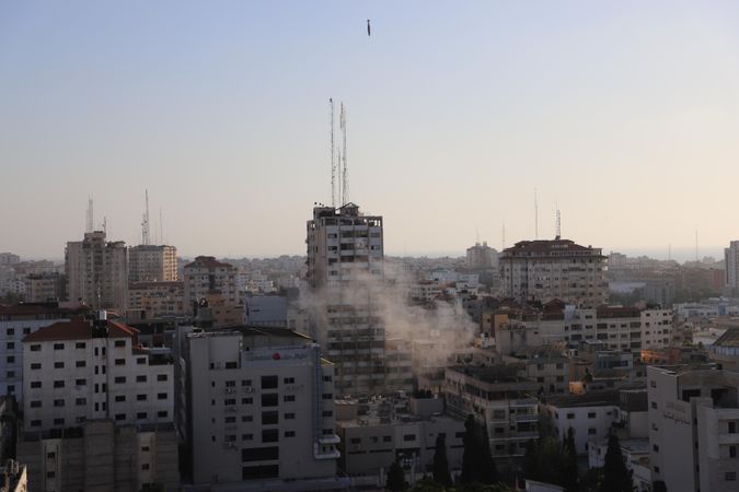 Gaza cityscape right after Israeli airstrike at sunrise