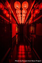 Lit red lanterns in a dark corridor 4M73G0