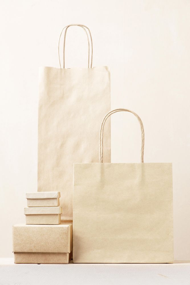 Disposable recycling packages, paper bags and boxes on table