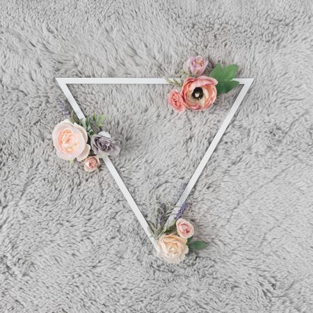 Triangle on grey carpet with flowers