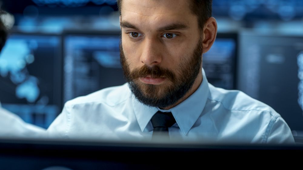 Neural Network and Machine Learning Engineer Working Hard at His Workstation.